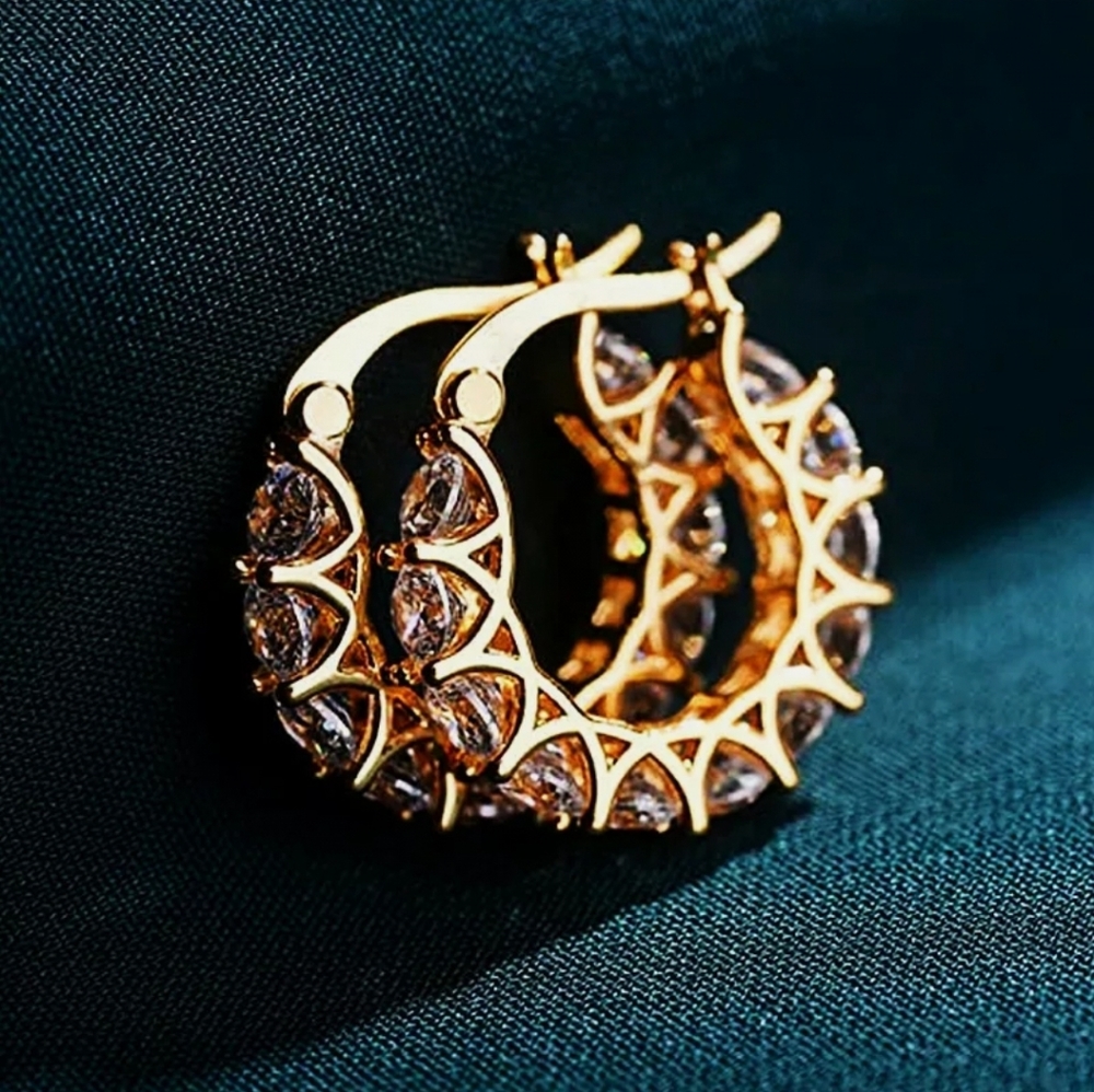 Sterling Silver with gold plating with CZ clear.